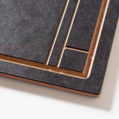 The Frank Lloyd Wright Large Cut and Serve Board close up detail in Slate/Natural