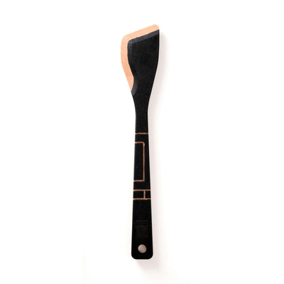 The Frank Lloyd Wright Utensil Set includes the Large Spoon, Paddle and Sauté Tool in Slate/Natural this image features the sauté tool