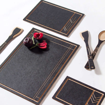 The Frank Lloyd Wright Collection featuring Cut and Serve Small, Medium and Large Boards, Saute Tool, Large Spoon & Paddle in Slate/Natural